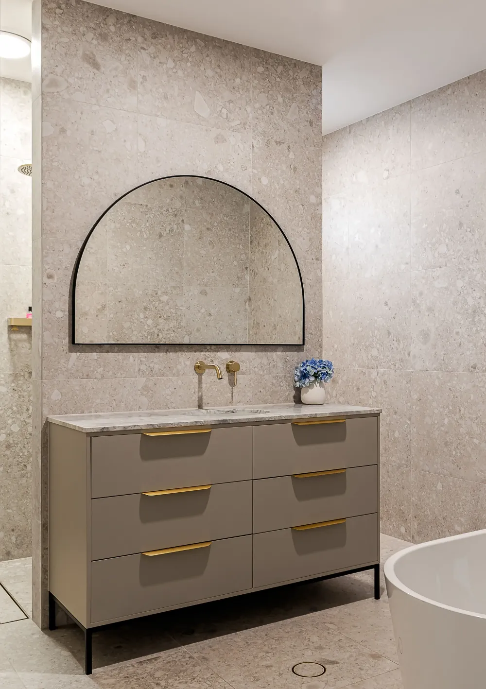 Bathroom vanity with arched mirror